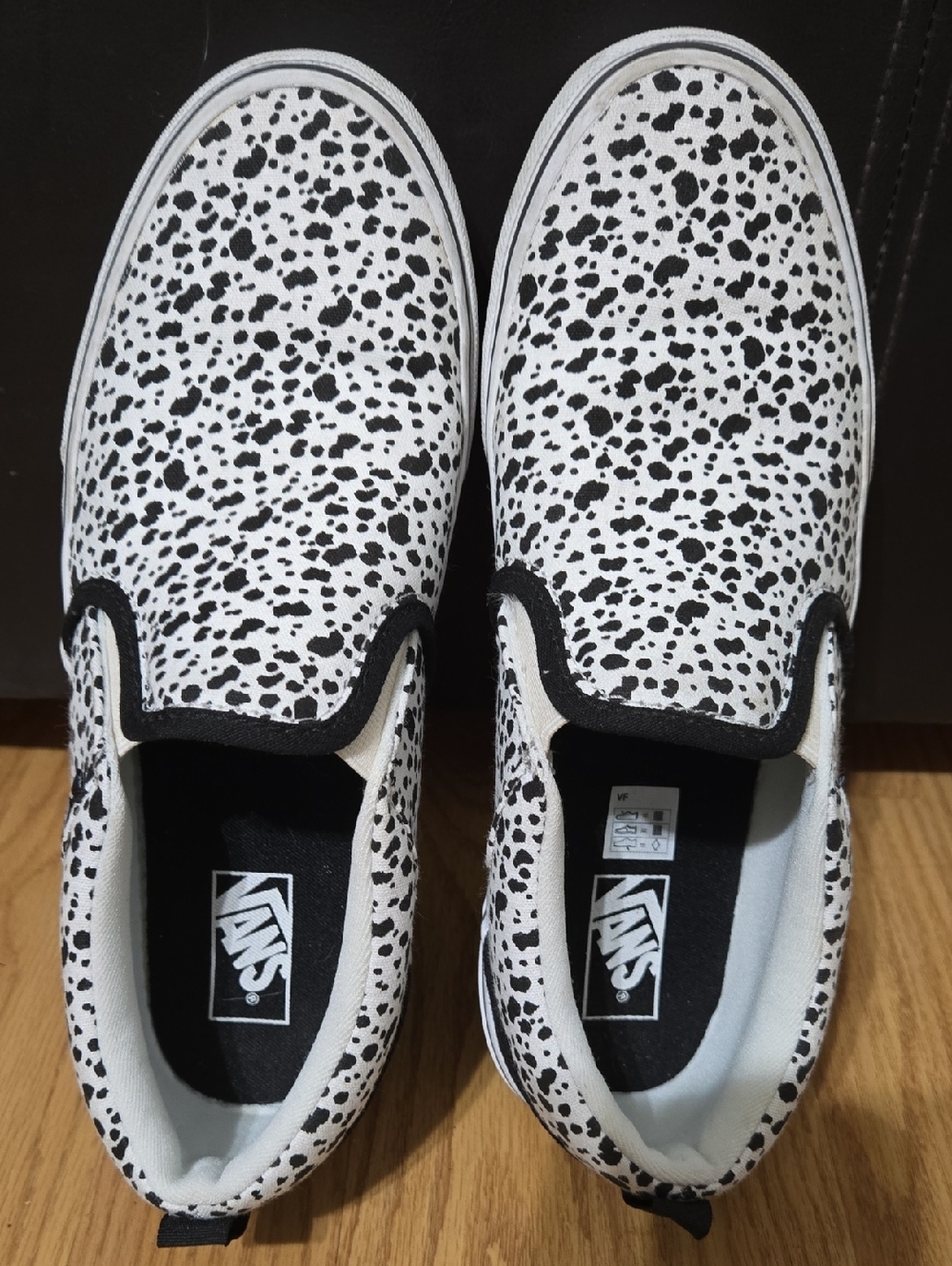Vans Slip-On Sneakers in White with Black Dalmatian Spots